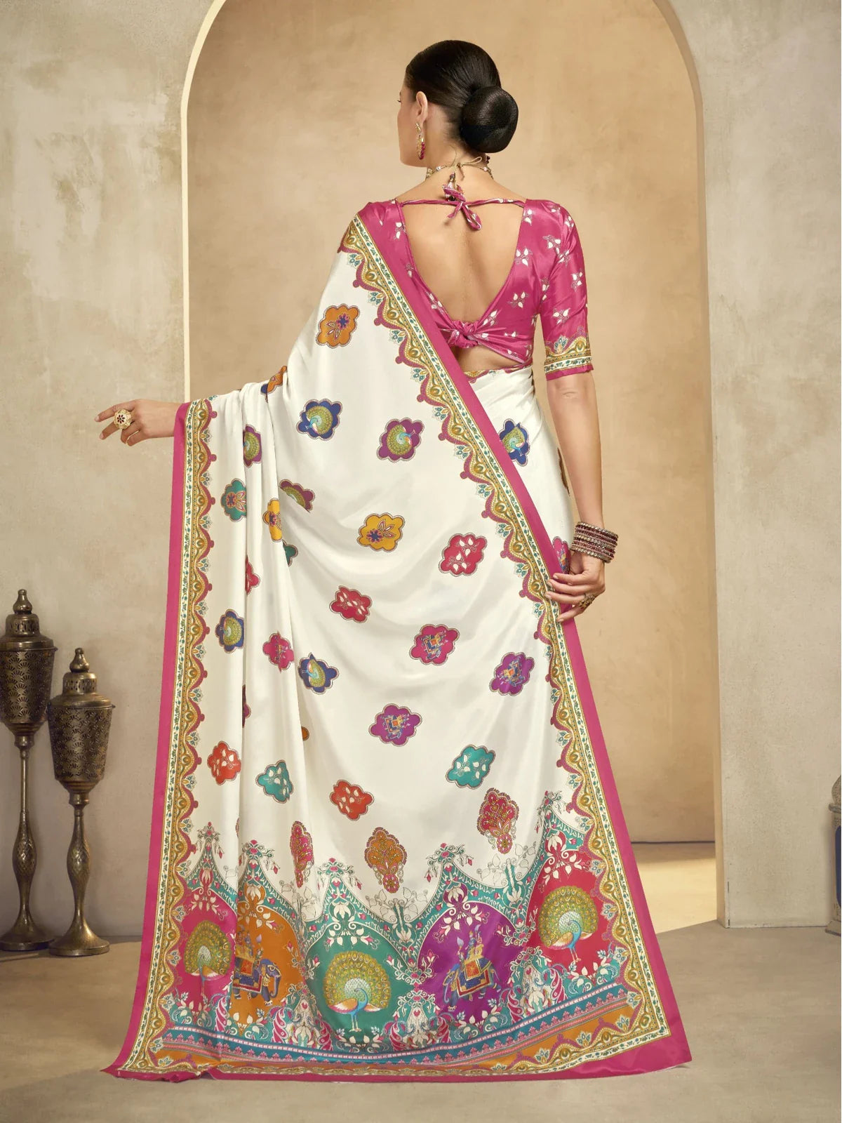 Tarani white crepe saree back view showing open back pink blouse and flowy drape