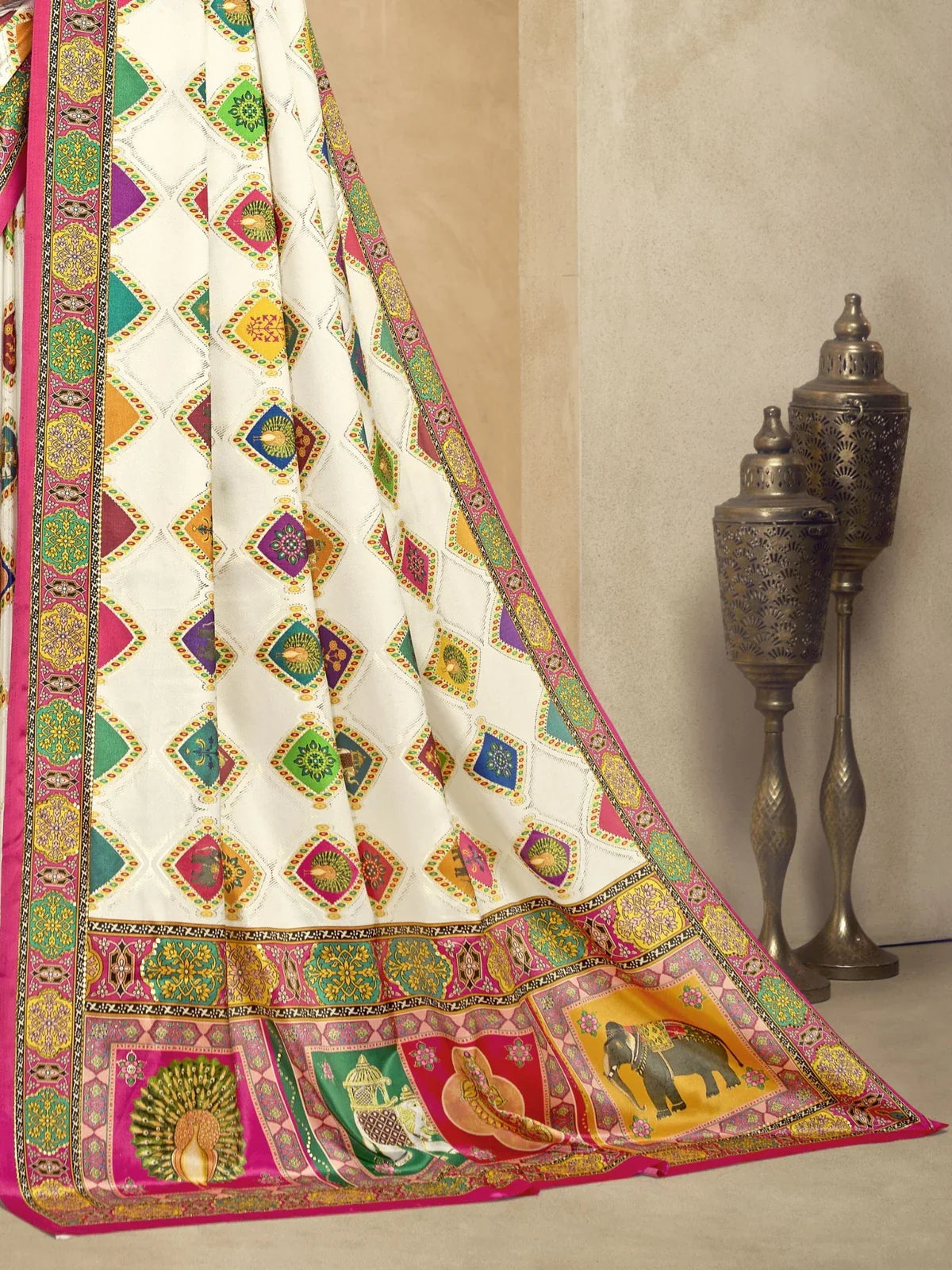 Tarani white crepe saree with colourful foil motifs and ethnic border pallu close-up view