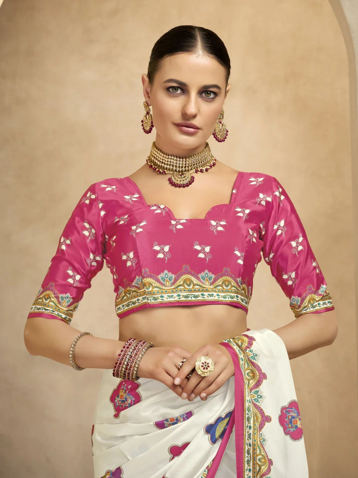 Tarani crepe saree close-up showing pink designer blouse with foil motifs