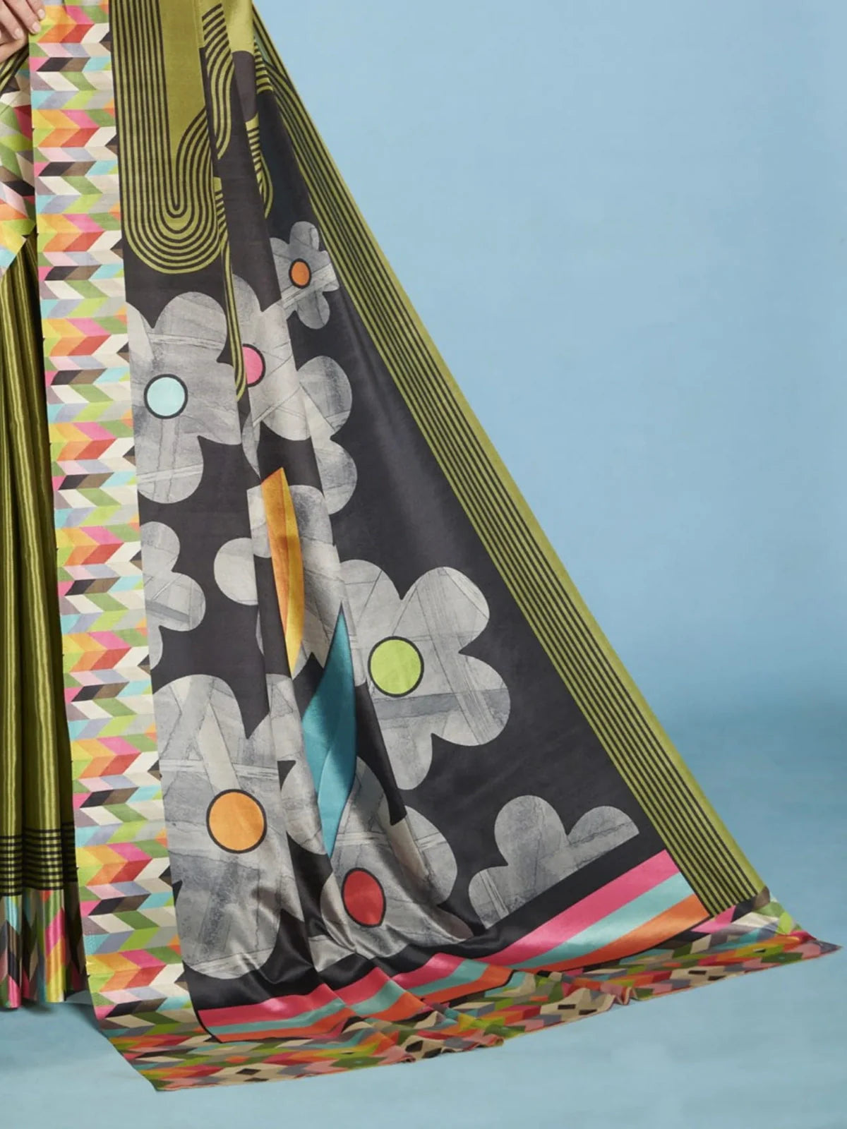 Tarani designer green crepe silk saree with floral print pallu and colorful geometric border closeup