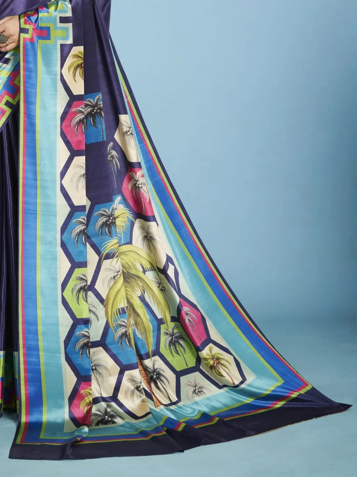 Tarani navy blue crepe silk saree pallu view showing multicolor tropical pattern and sleek finish