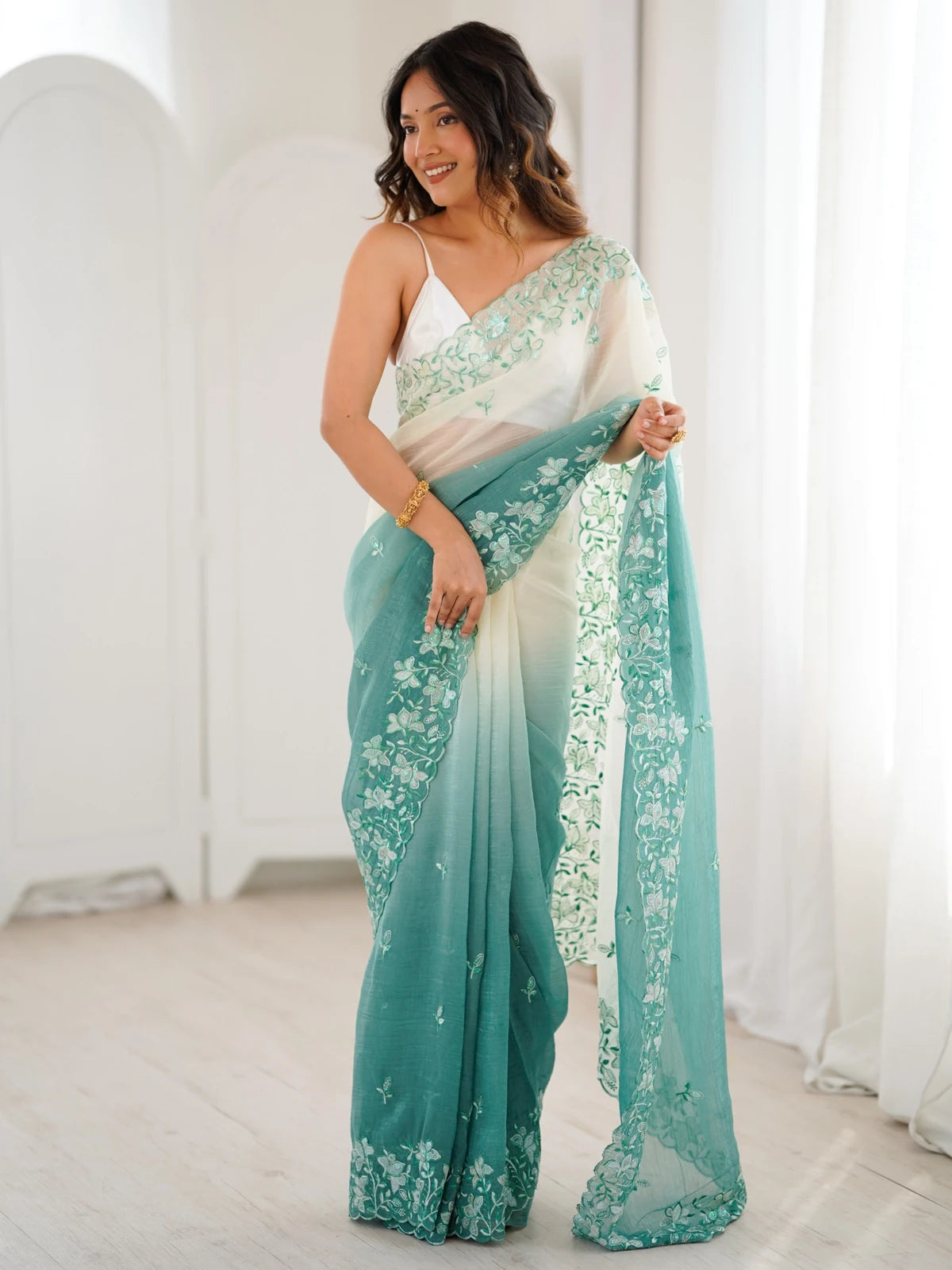 Tarani green crunchy saree front view with elegant embroidered detailing