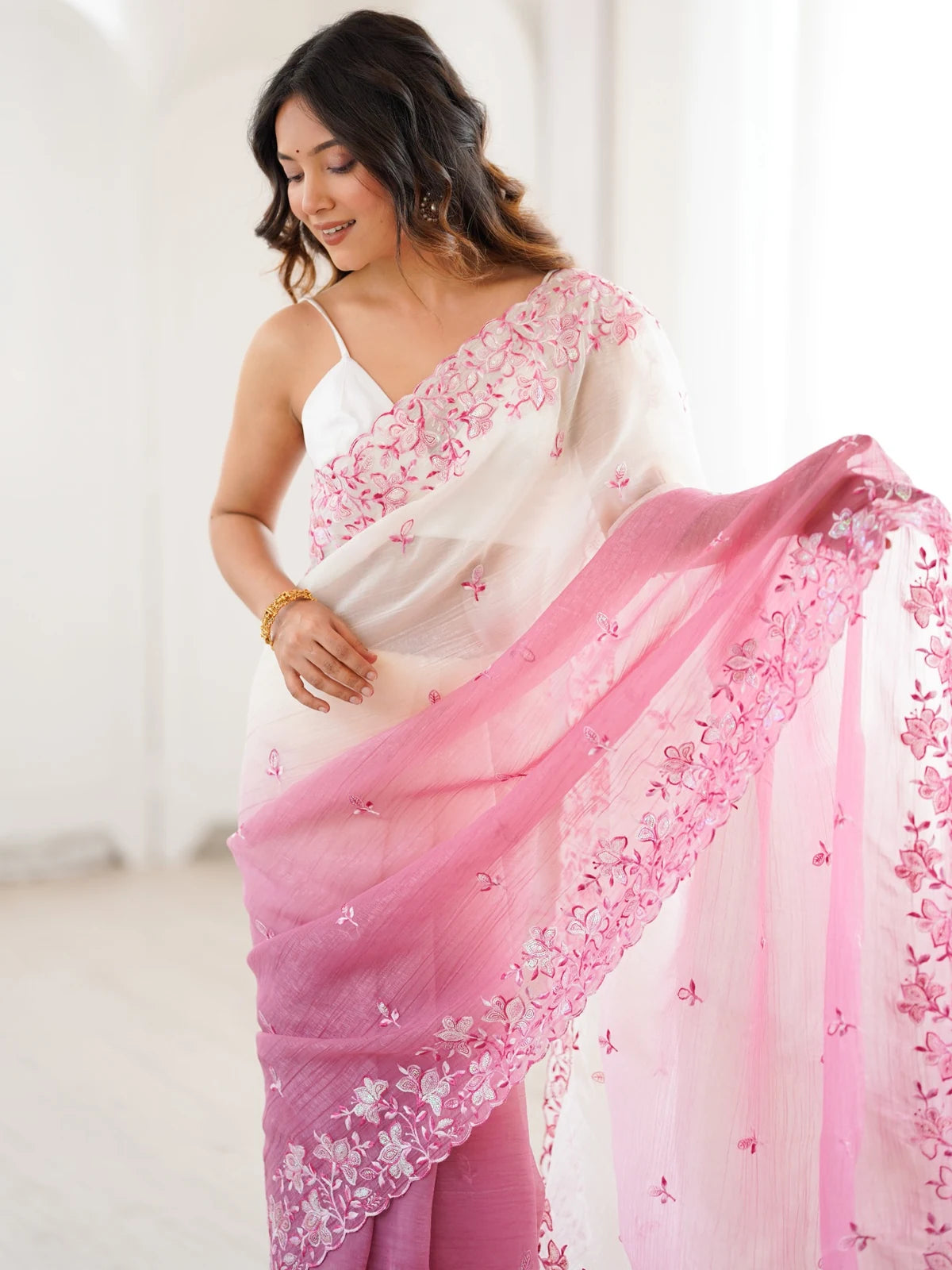 Tarani pink crunchy saree pallu view with sequence embroidery border and elegant drape