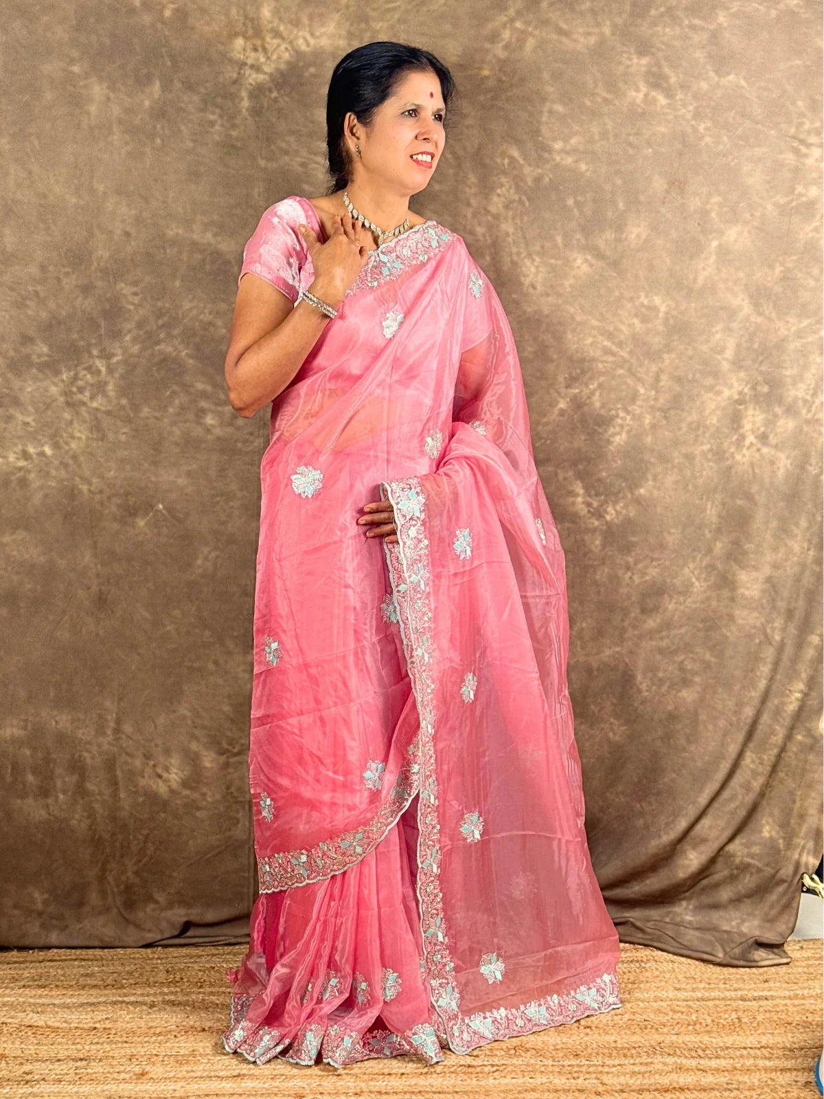 Tarani saree pink full drape angle with border detailing and soft festive look