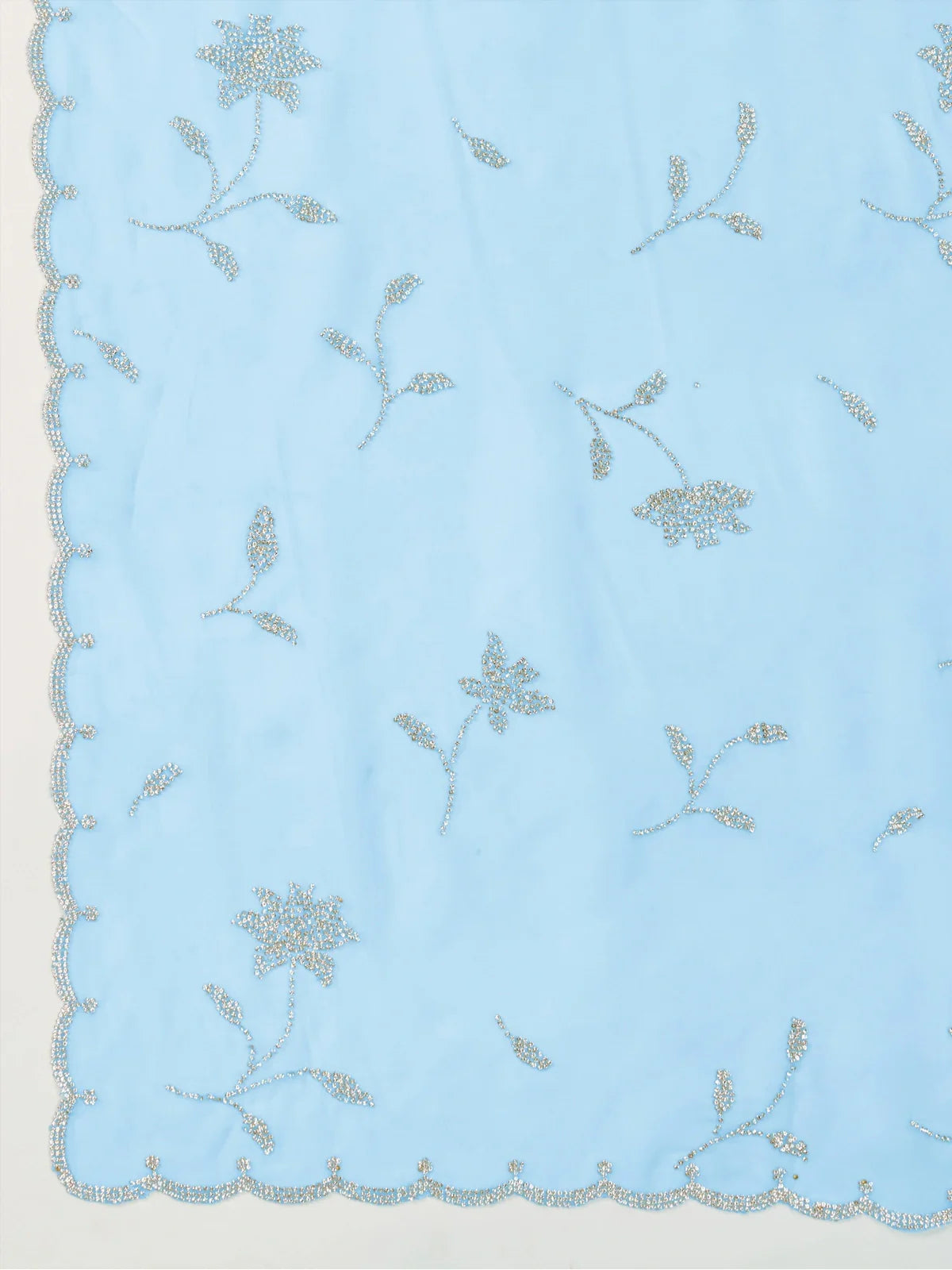 Tarani pallu view of blue crystal viscose saree with heavy floral zarkan work and scalloped edges