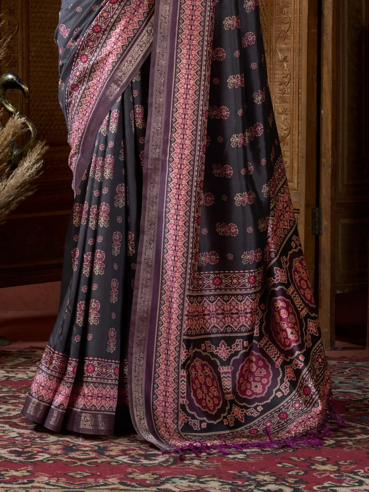Tarani detailed pallu and border of black digital saree with pink maroon ajrak motifs