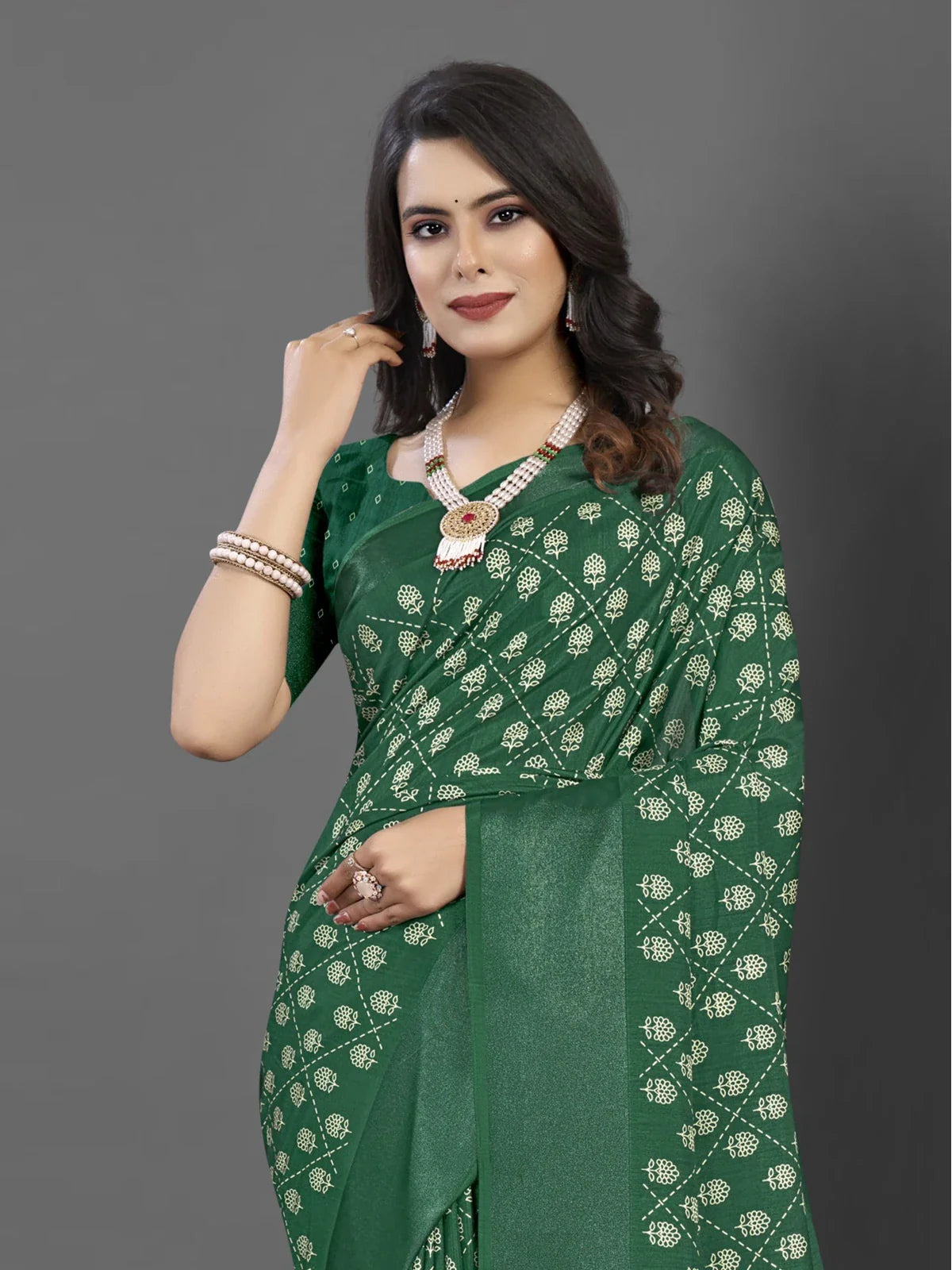 Tarani premium green Dola silk saree upper body view with model showcasing intricate pattern