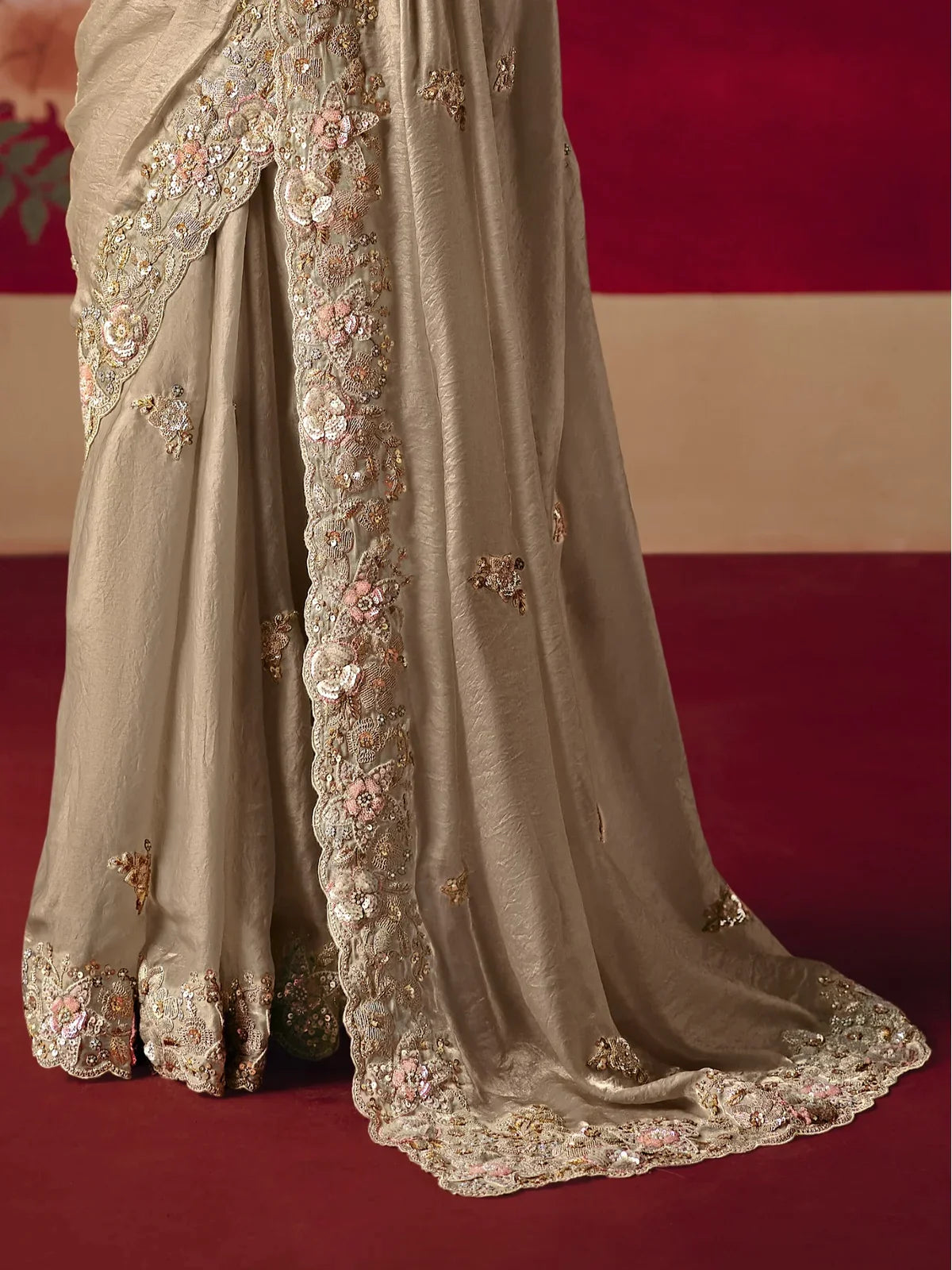 Tarani beige party saree with embellished pallu border and sequin floral motifs
