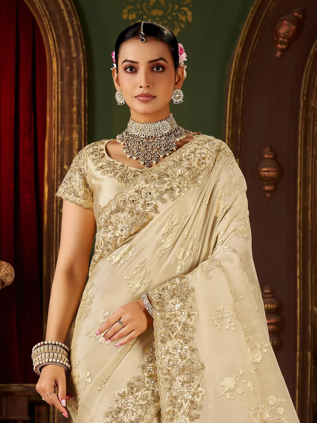 Tarani beige fancy saree upper body view with floral embroidered blouse