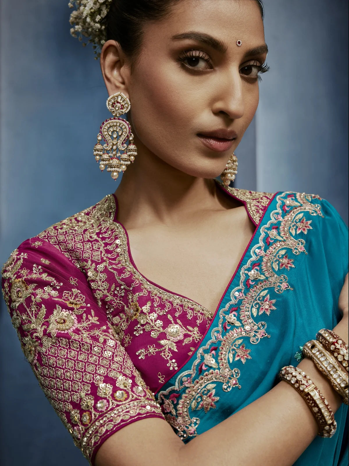 Tarani premium blue saree closeup view showcasing embroidery and blouse detailing