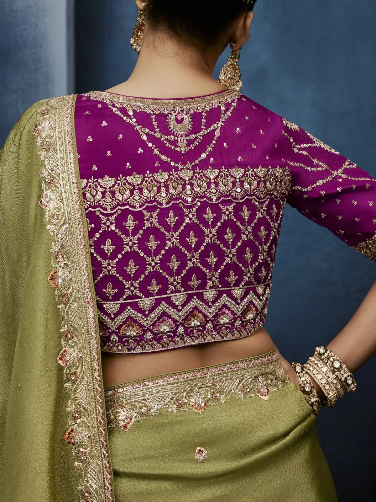 Tarani green saree blouse back view with intricate zardosi embroidery and border detailing