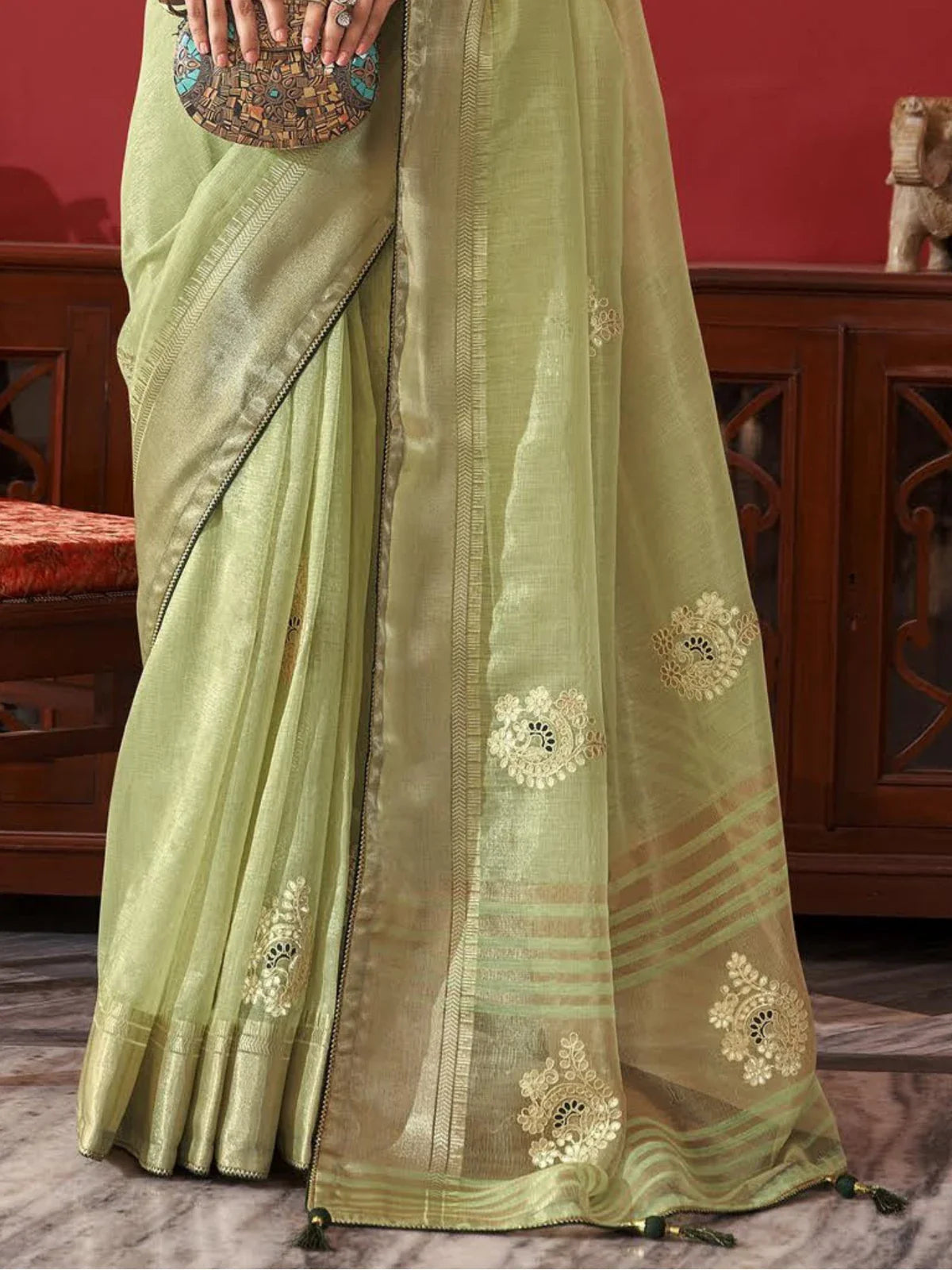 Tarani green fancy saree closeup view highlighting embroidery work and texture