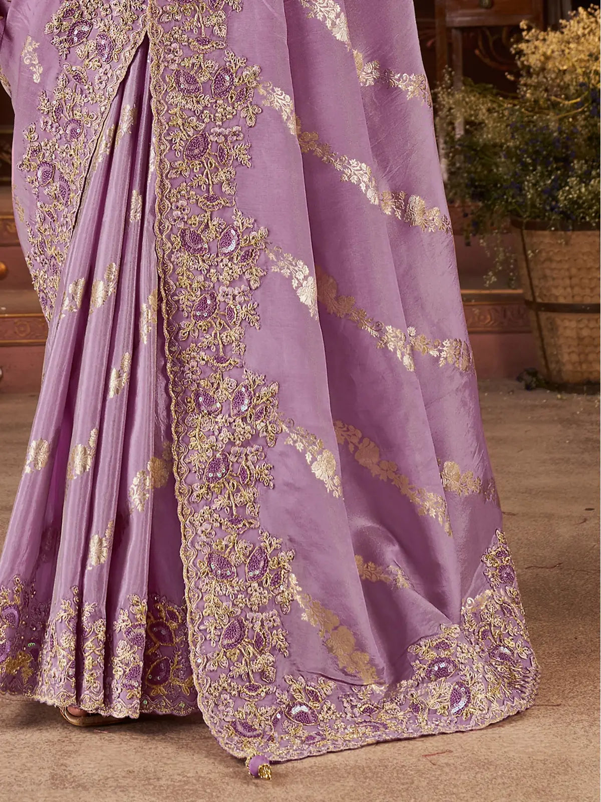 Tarani fancy saree closeup highlighting zari floral embroidery and fabric sheen