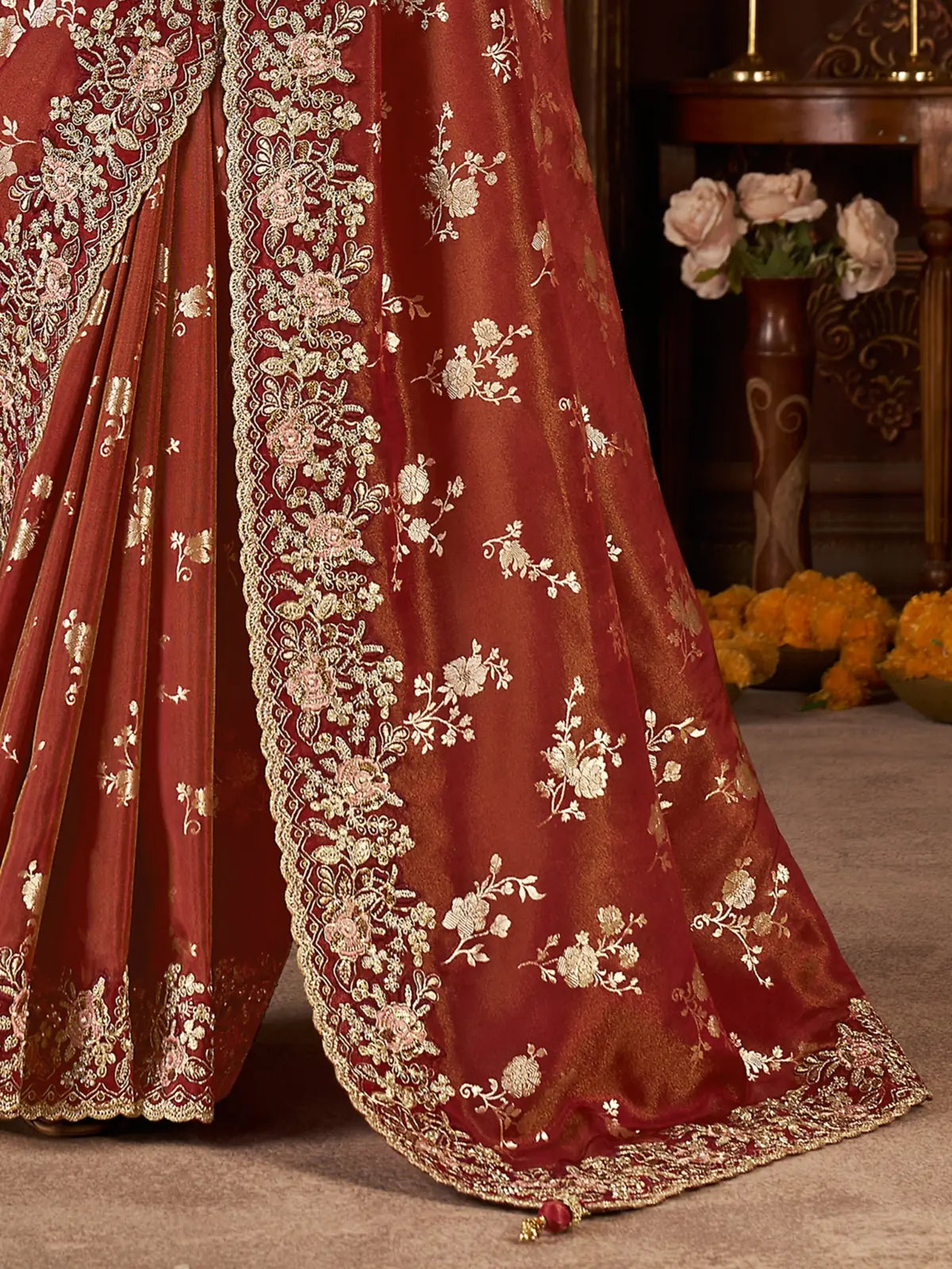 Tarani maroon saree close pallu view with zari work and border detailing for festive weddings