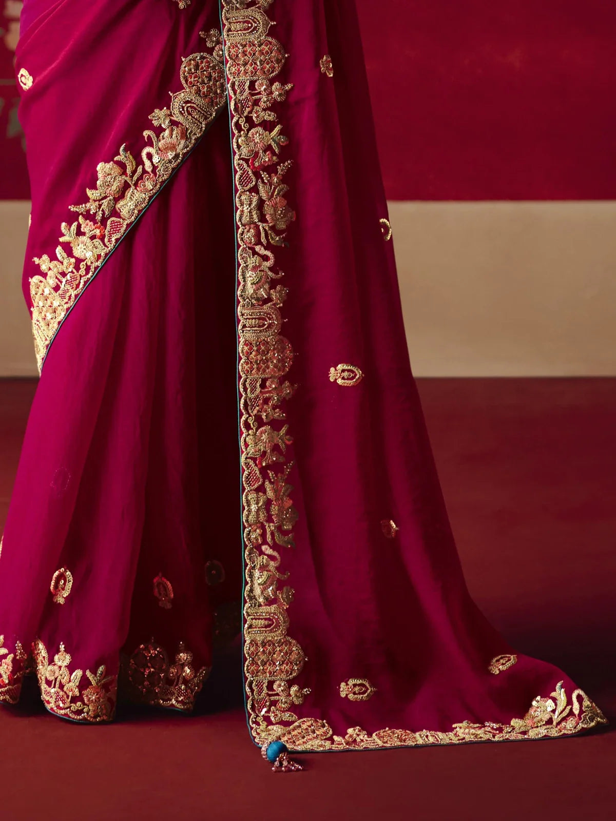 Tarani fancy maroon saree detailed pallu embroidery in gold and sequin close-up view