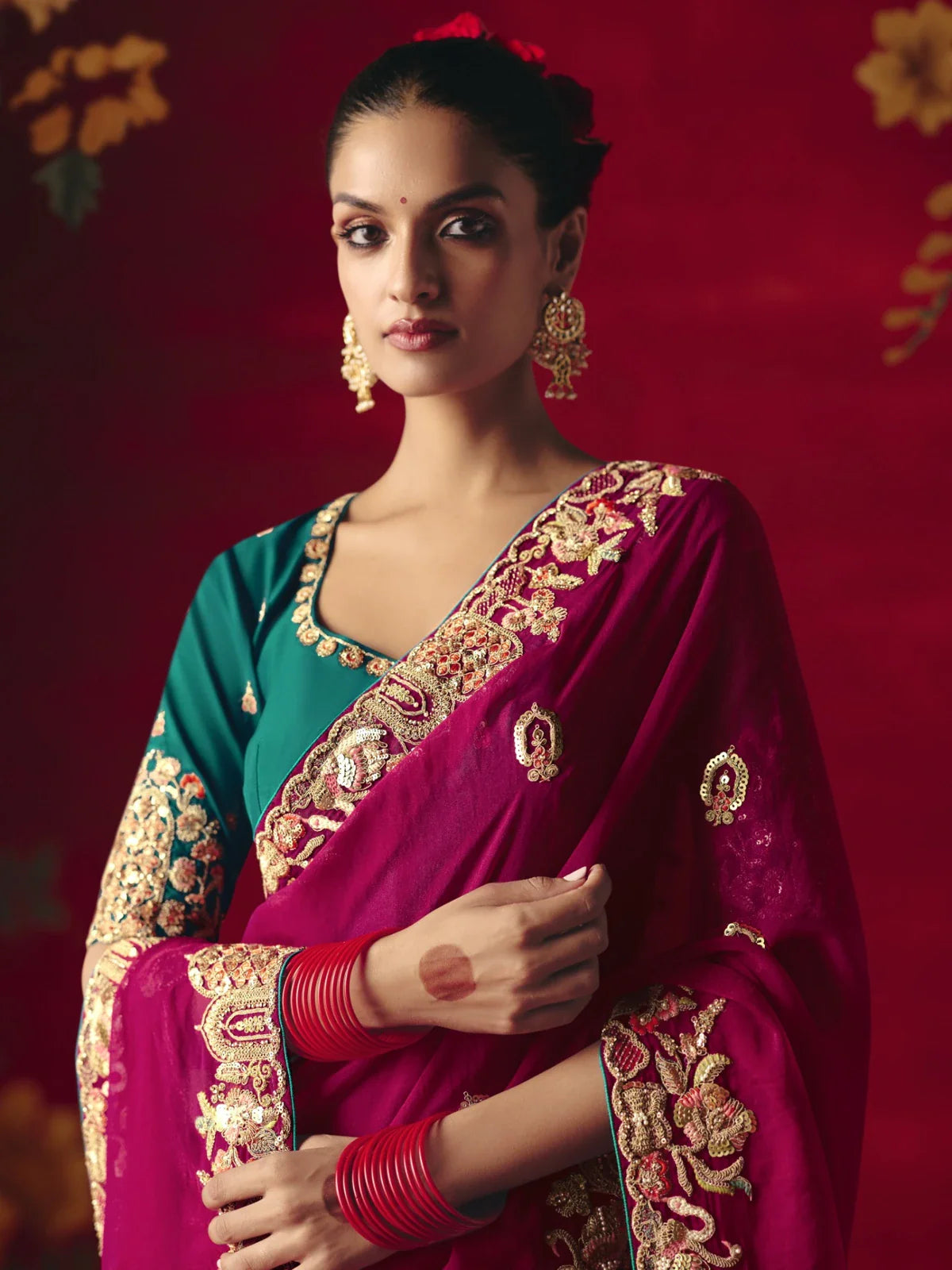 Tarani maroon saree with sequin embroidery and green contrast blouse close-up upper body view