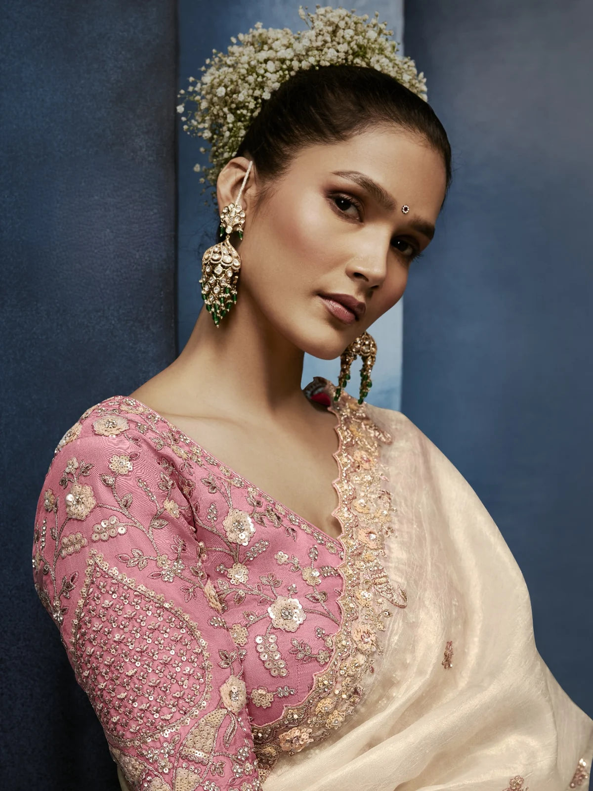 Tarani premium embroidered blouse upper body view with elegant off white saree drape