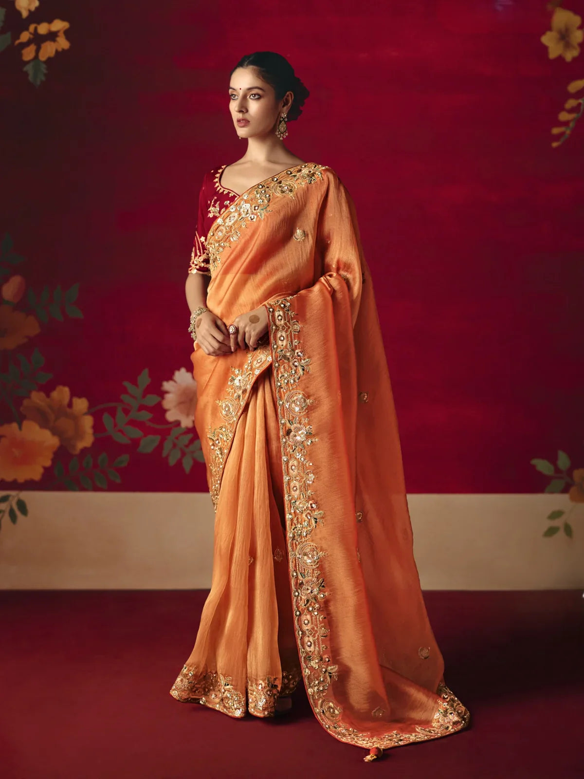 Tarani fancy orange saree with rich embroidery and sequins work in full view for party and festive wear