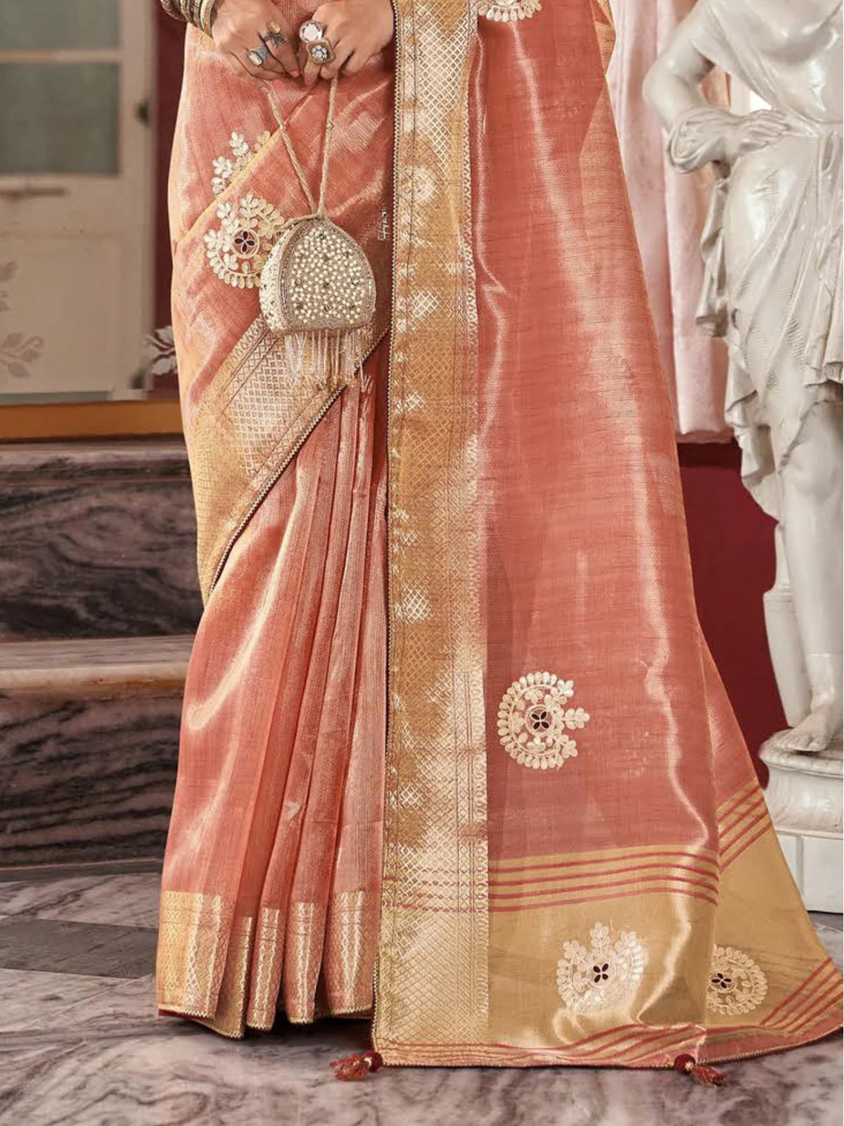 Tarani peach fancy saree lower pleats and pallu border with floral embroidery design