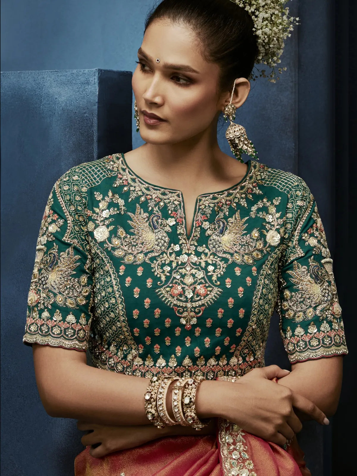 Tarani peach fancy saree upper body view with detailed embroidered blouse and zari work