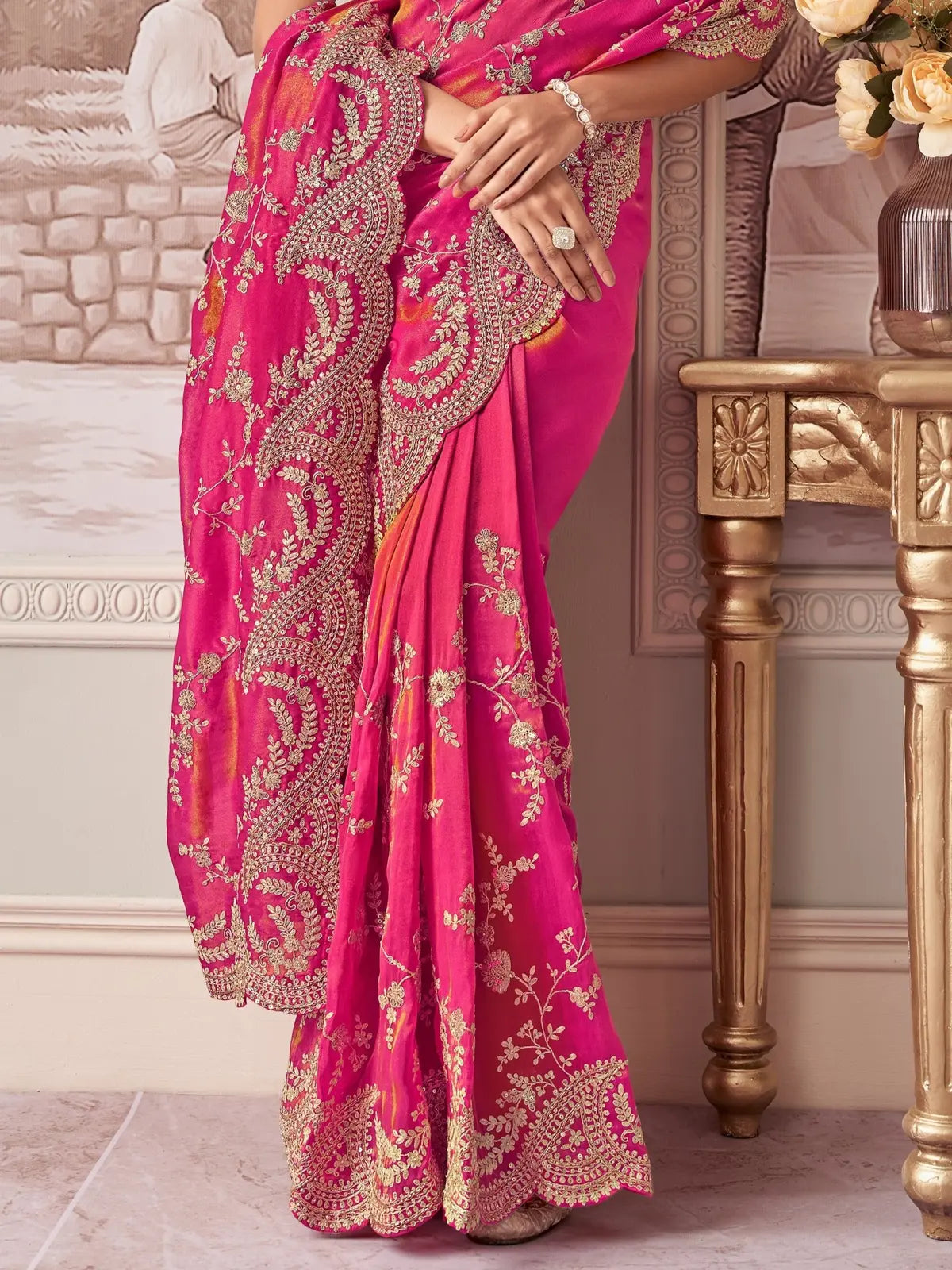 Tarani pink fancy saree closeup view showing intricate zari embroidery and cutwork border