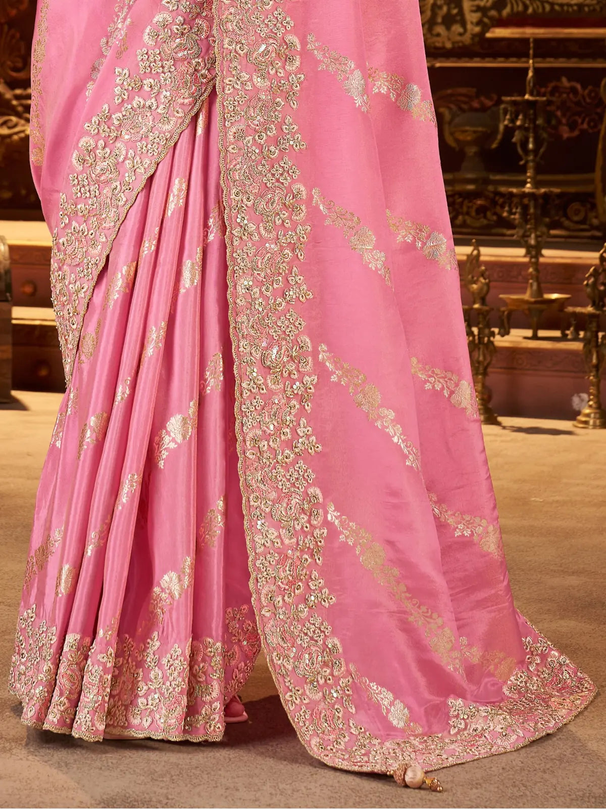 Tarani soft fancy pink saree closeup showing detailed zari embroidery border and fabric texture
