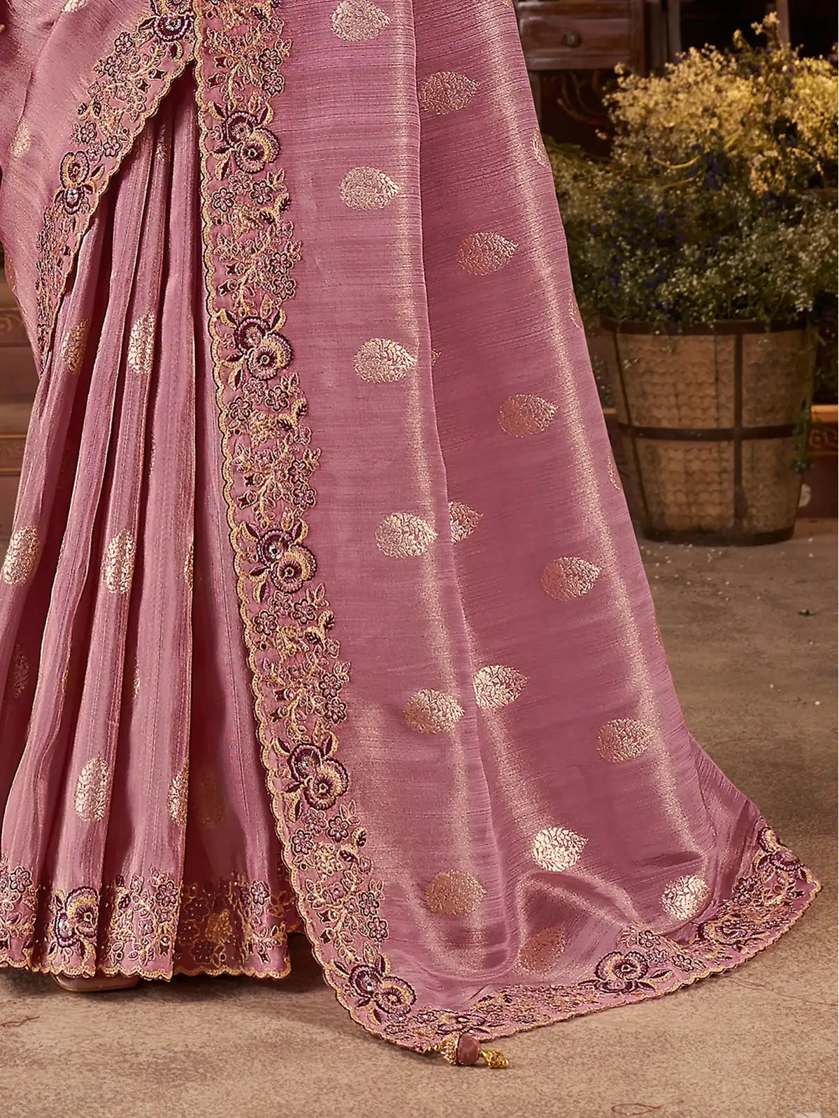 Tarani party wear pink saree pallu view with heavy zari embroidery and latkan detail