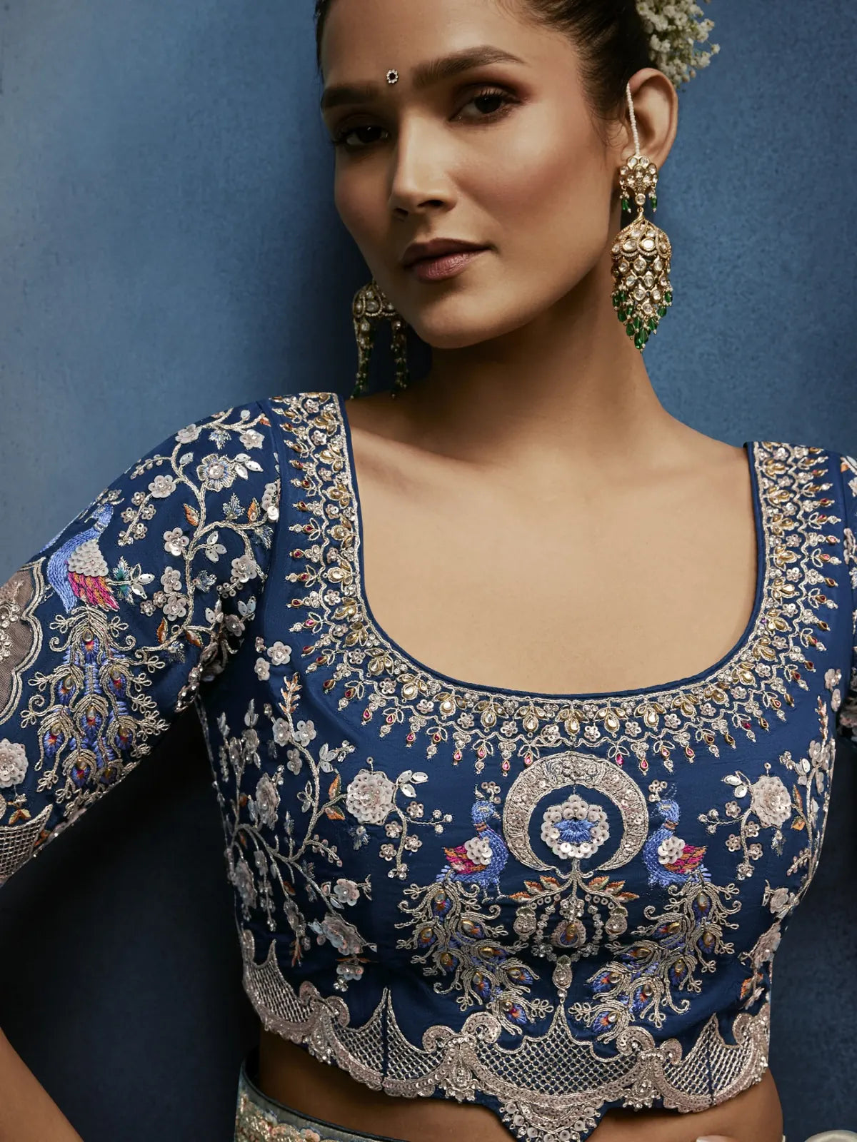 Tarani designer embroidered blouse closeup with sage green saree detailing