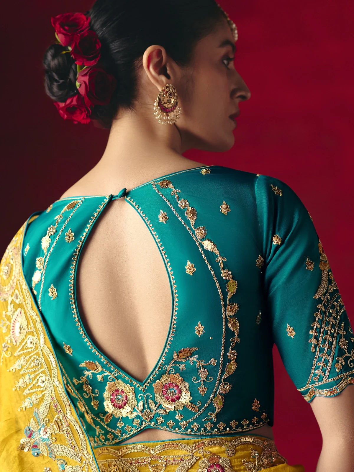 Tarani yellow saree back blouse design with embroidery and cutwork by Tarani