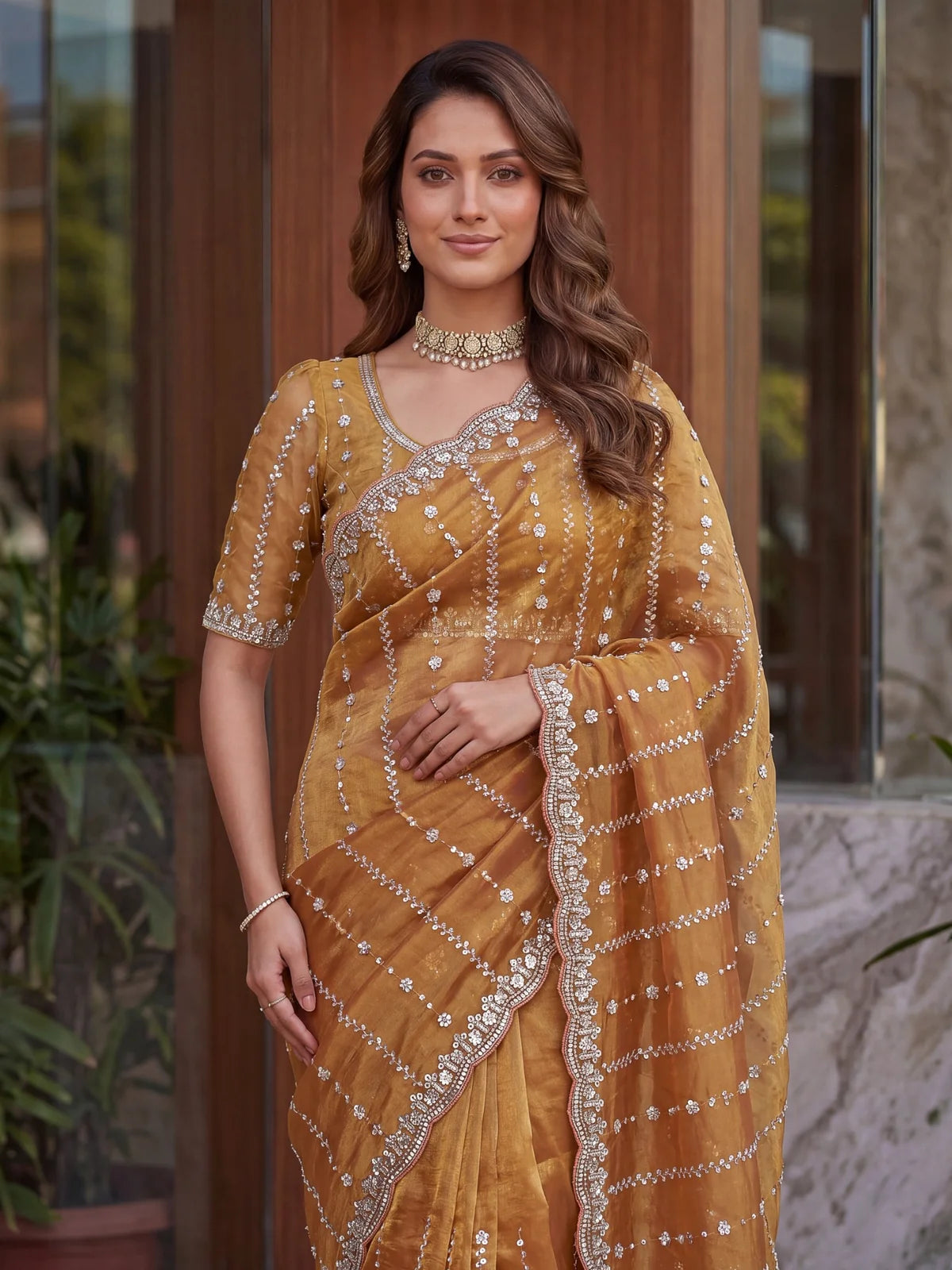 Tarani golden Fandy Satin saree upper body view with embroidered blouse and sequins detailing