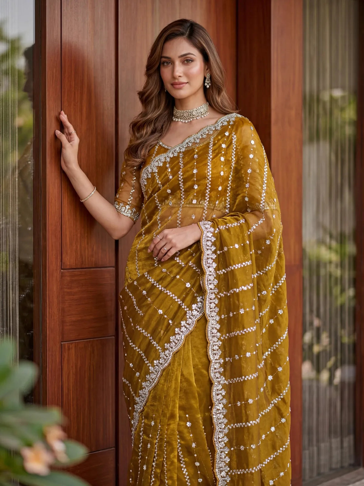 Tarani mustard Fandy Satin saree upper body view with embroidered blouse and sequins detailing