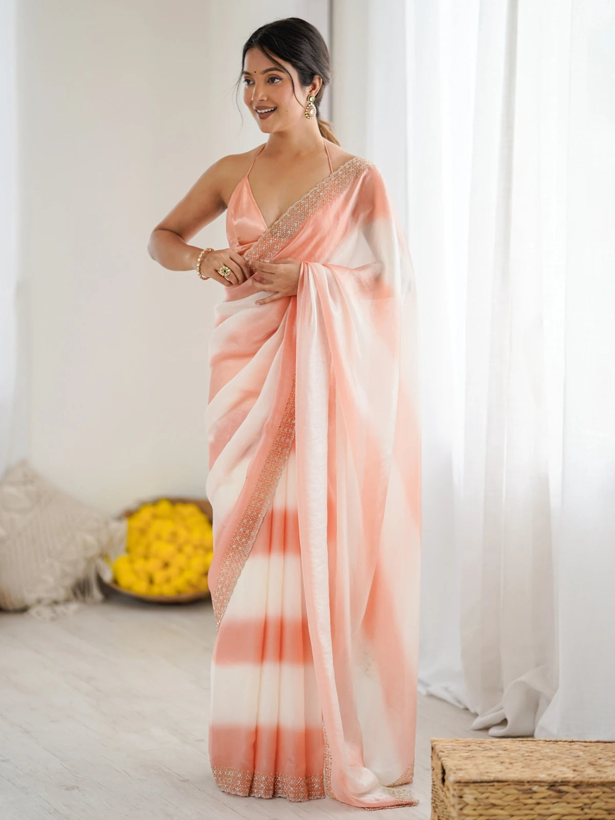 Tarani Drishya peach and white saree front view with shimmering border and drape