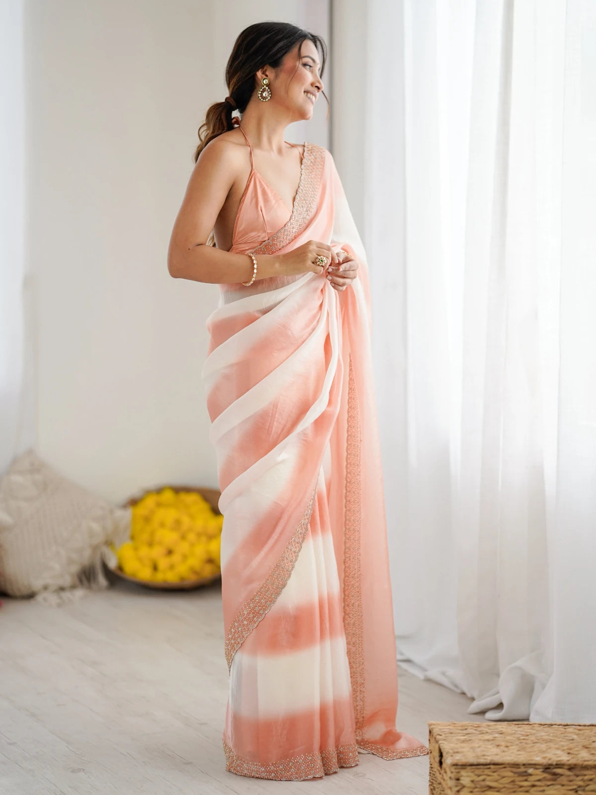 Tarani Drishya peach saree side view with graceful pallu and Zarkan Diamond Work