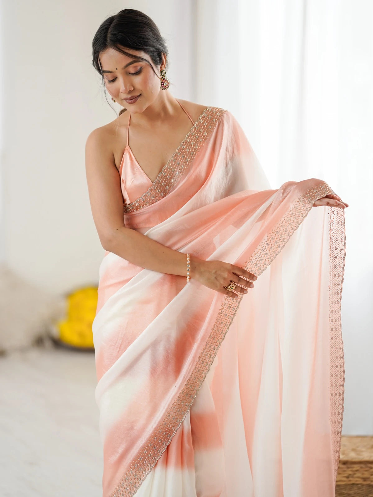 Tarani Drishya peach Fandy Satin saree upper body view with elegant border and blouse
