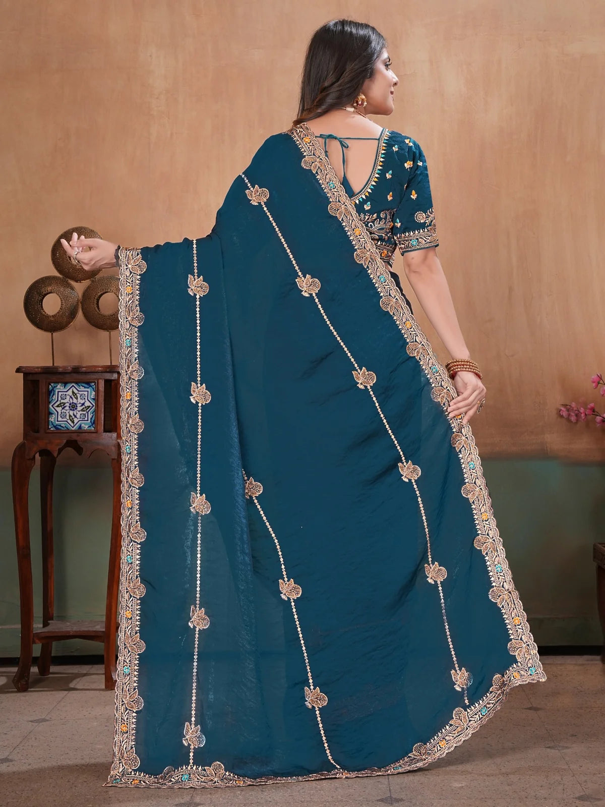 Tarani teal Soft Fandy Satin saree back view with embroidered pallu