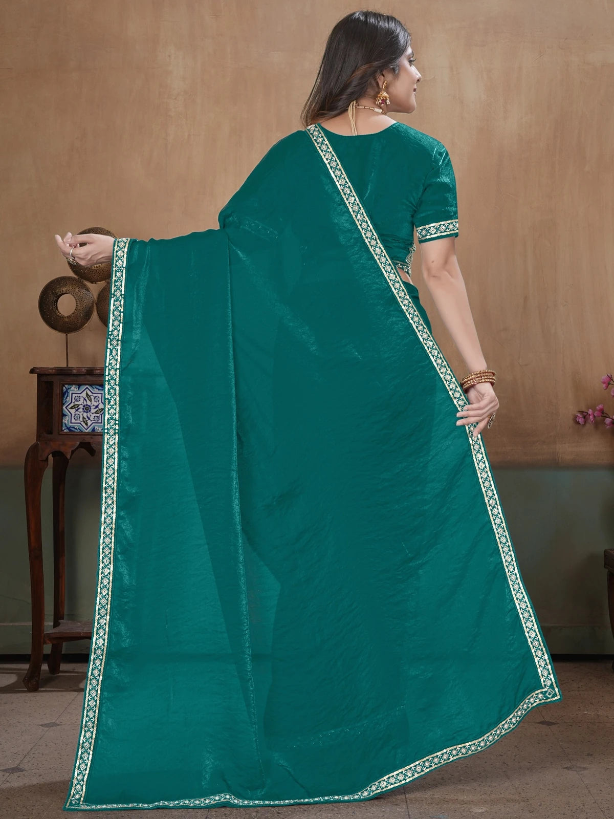 Tarani teal Soft Fandy Satin saree back view with elegant pallu and embroidered border
