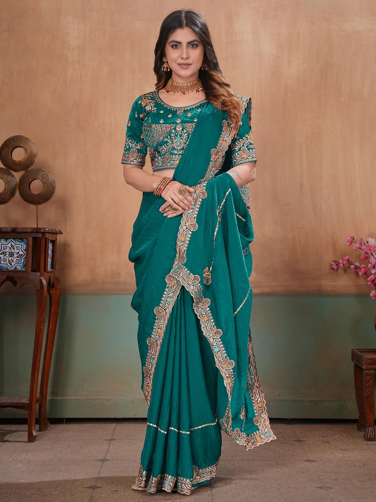 Tarani teal Fandy Satin saree front pose showing elegant embroidery border and blouse