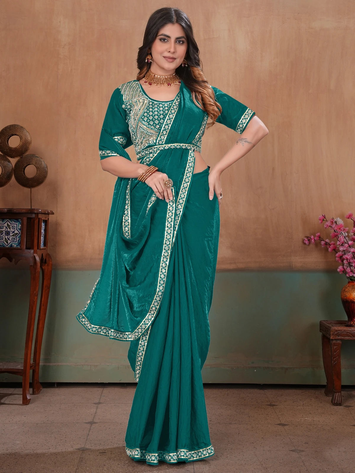 Tarani teal Soft Fandy Satin saree front view with elegant embroidered border
