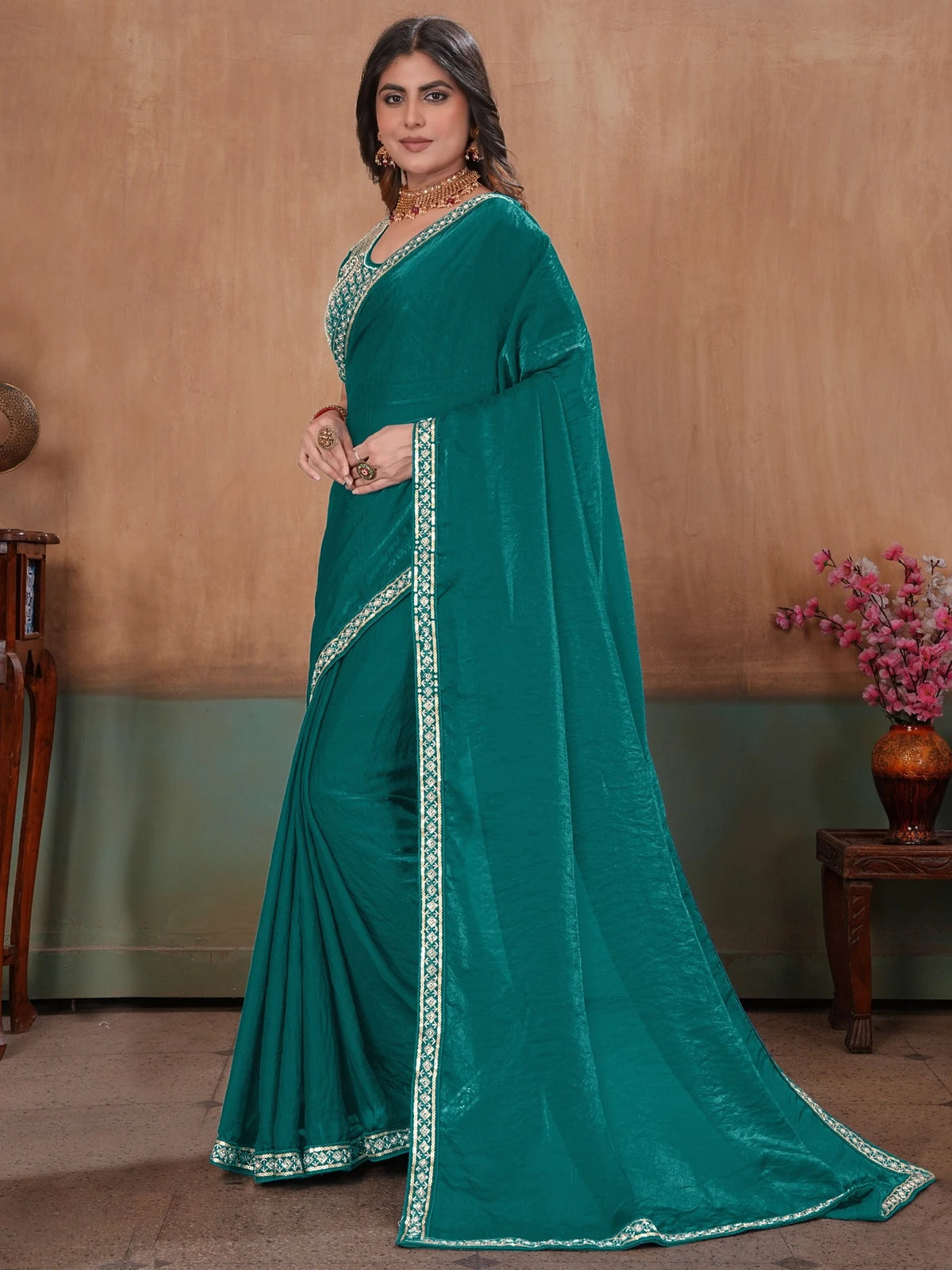 Tarani teal Soft Fandy Satin saree side view showing graceful drape and border