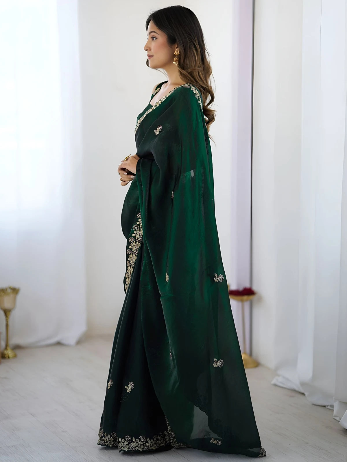 Tarani green Fandy Satin Silk saree side view showing graceful drape and cutwork border