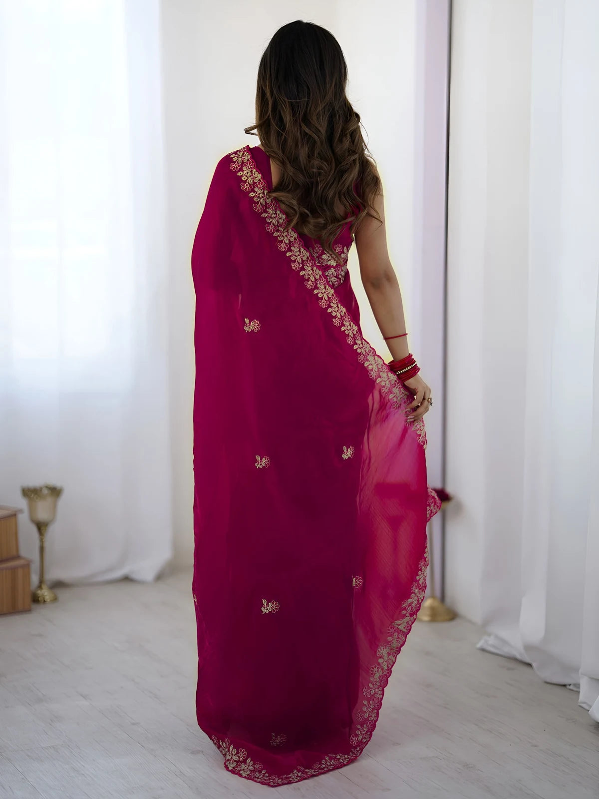 Tarani Ashmita magenta saree back view with embroidered pallu and elegant detailing