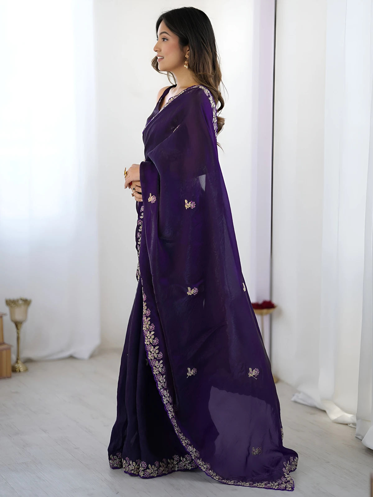 Tarani purple saree side view with elegant drape and embroidery