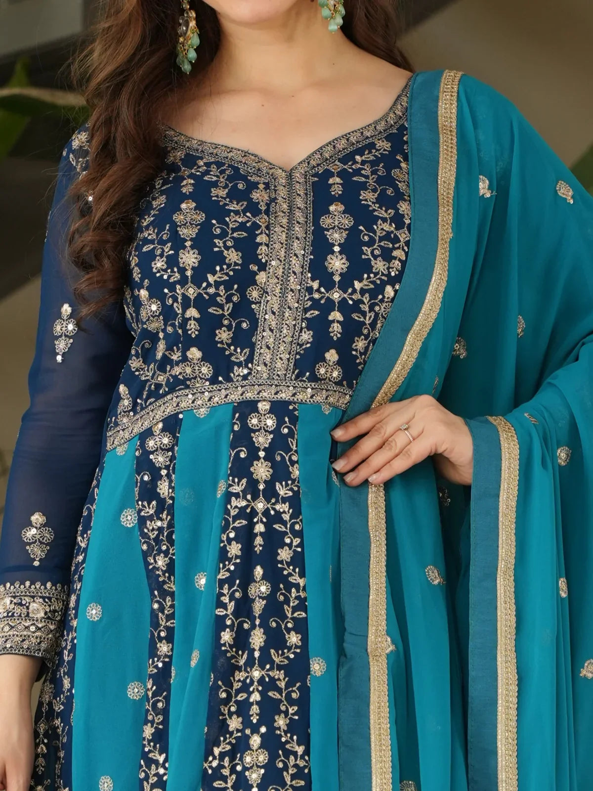 Tarani closeup of blue faux blooming gown with zari and sequins embroidery