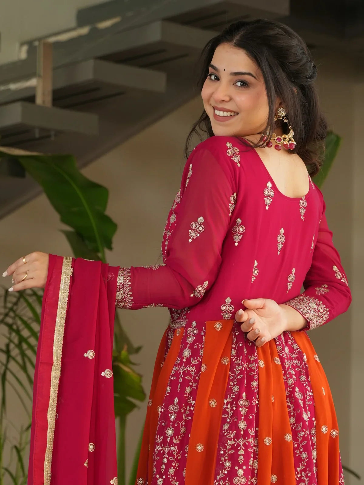 Tarani faux blooming pink gown back view showing embroidery and dupatta
