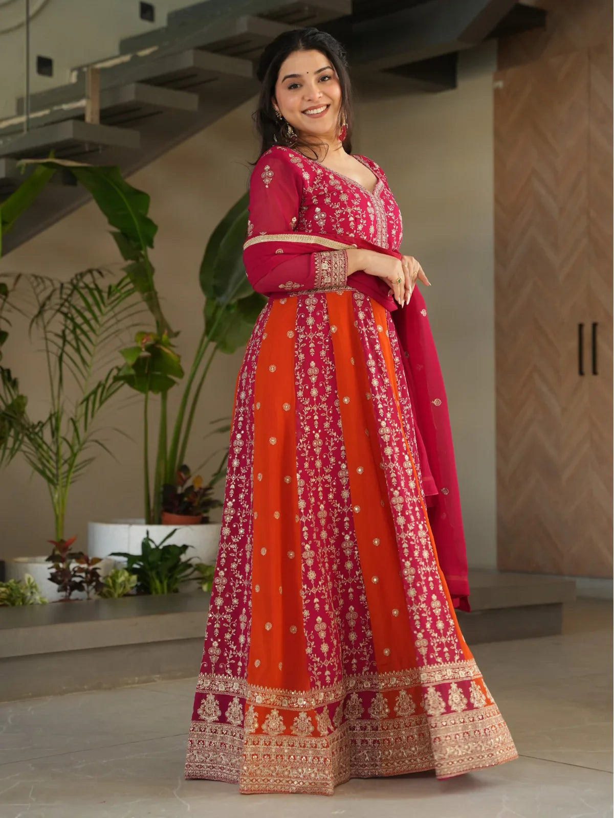 Tarani faux blooming pink gown side pose with elegant dupatta embroidery