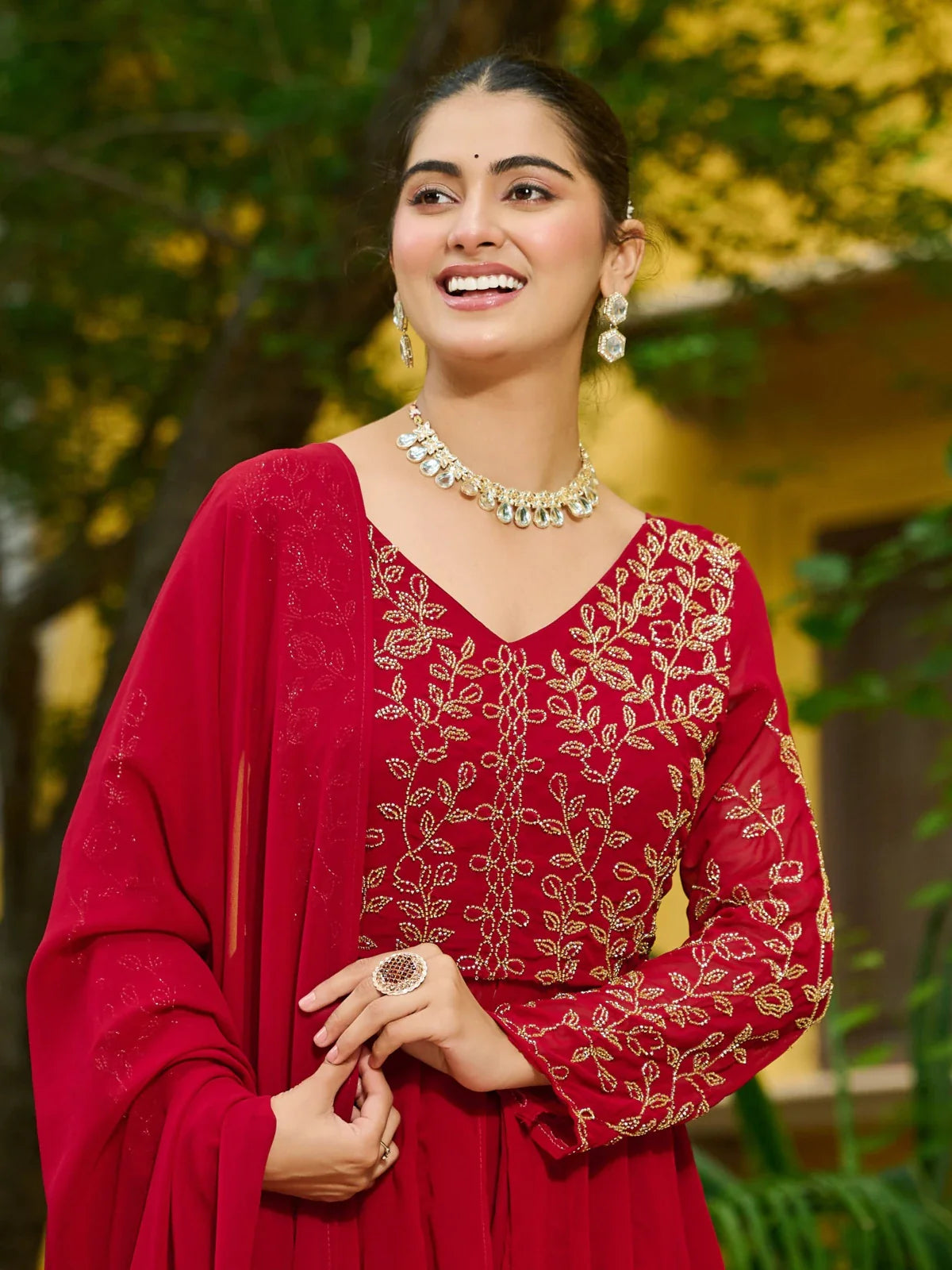 Tarani festive red faux blooming dress close-up of neckline and upper body embroidery