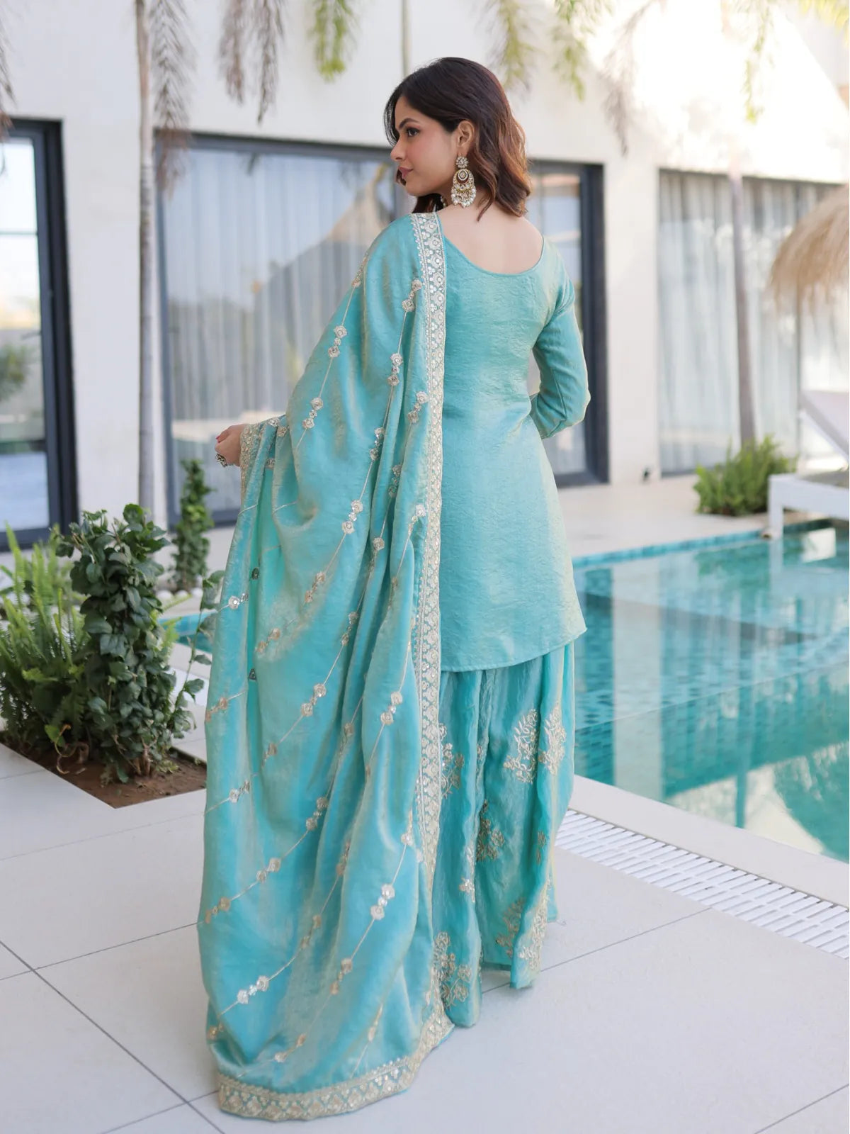 Tarani designer green Fendi party dress back view with embroidered dupatta and flared sharara