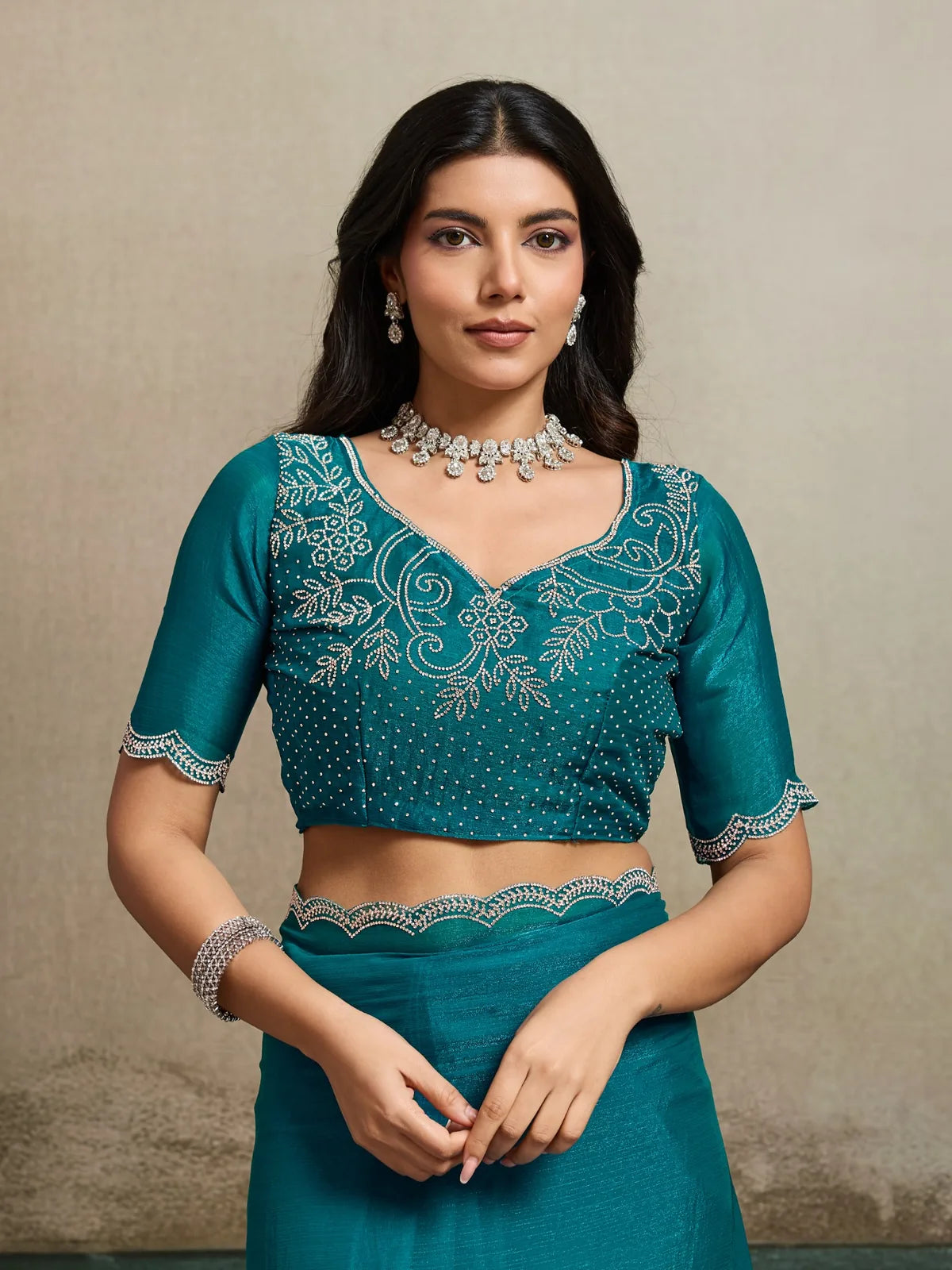 Tarani teal Fendy Chiffon Blooming saree blouse design with intricate Jarque work close view
