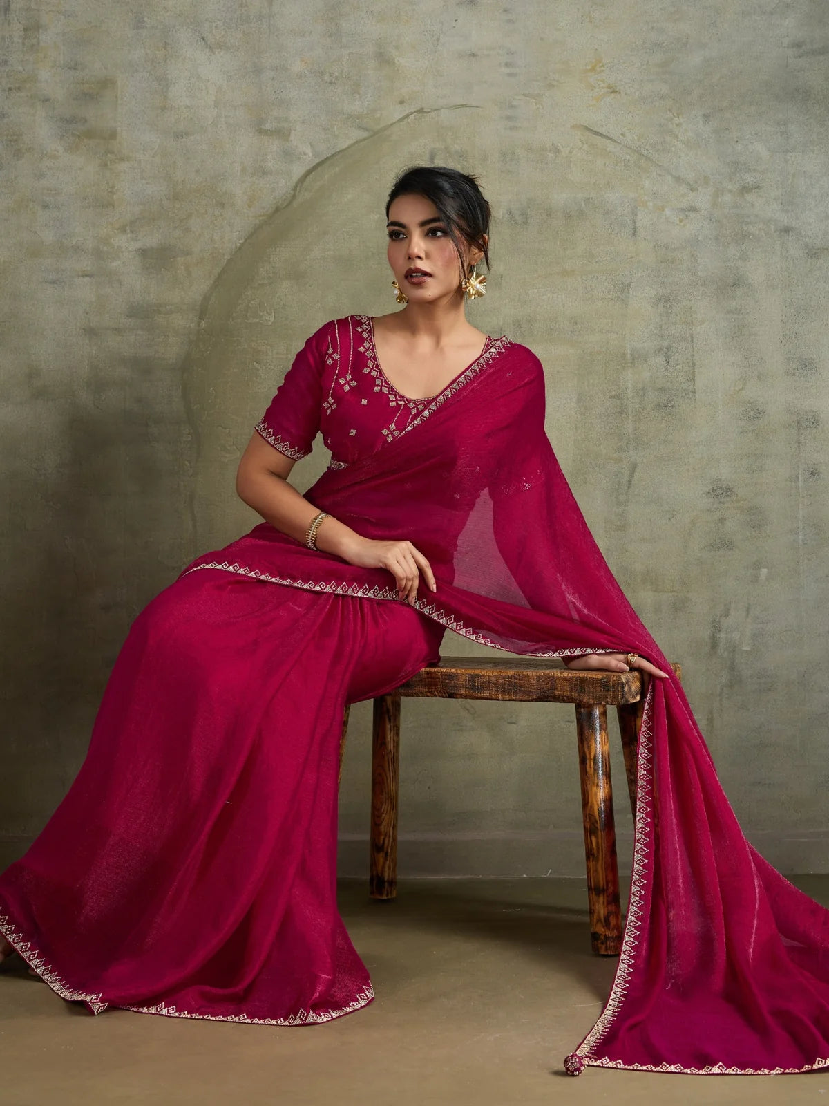 Tarani festive magenta saree front seated view with lightweight chiffon drape and Zarkan detailing