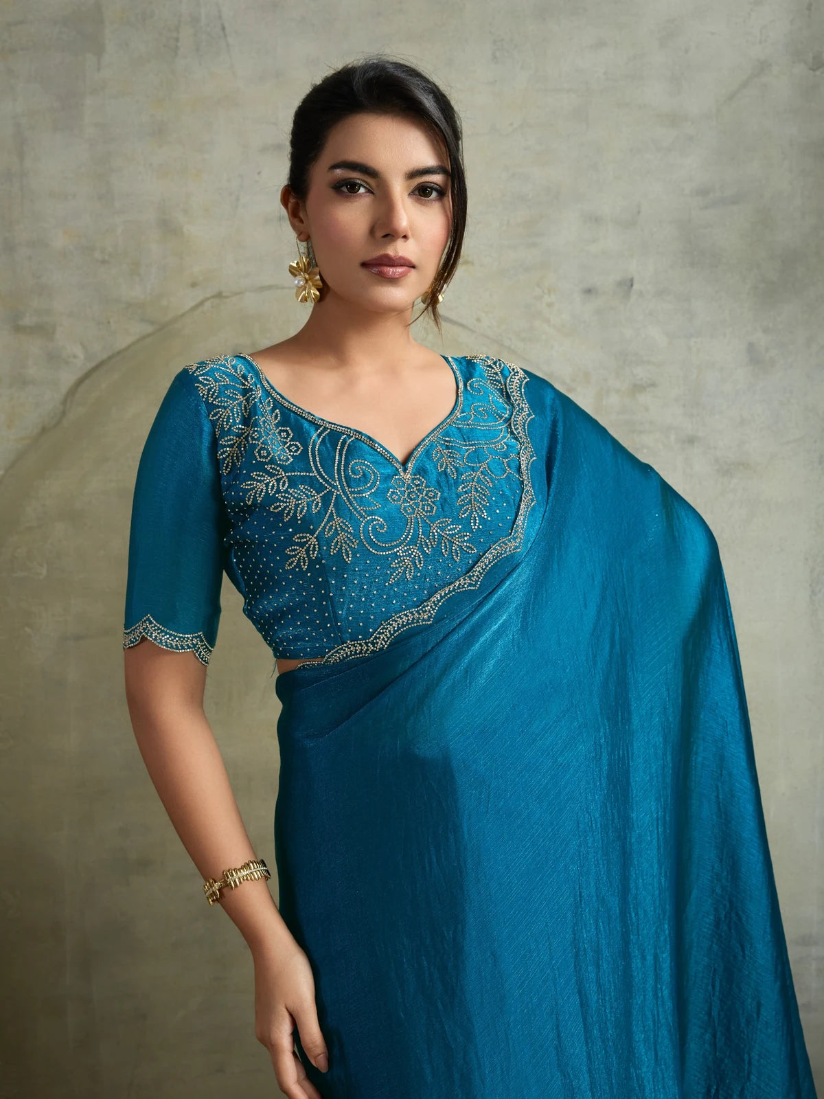 Tarani teal designer saree upper body view with detailed Zarkan embroidered blouse and scallop border